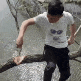 man-sitting-on-branch-chopping.gif